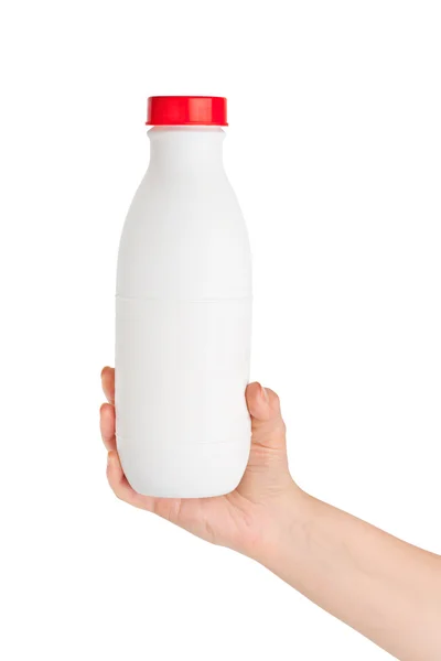 Mano con bottiglia di latte — Foto Stock