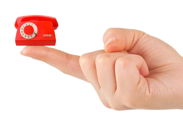Hand and small telephone — Stock Photo, Image