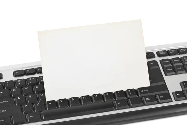 Computer keyboard and paper card — Stock Photo, Image