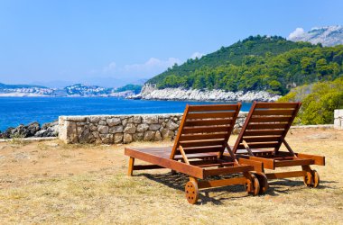 Longue on beach in Dubrovnik, Croatia clipart