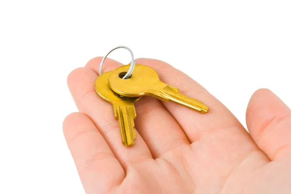 Hand giving keys — Stock Photo, Image