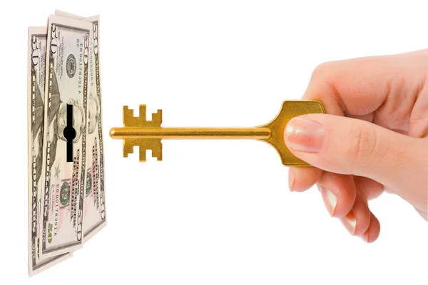 Hand met sleutel en geld — Stockfoto