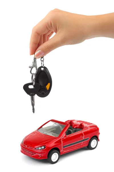 Hand met sleutel en auto — Stockfoto