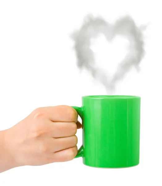 Hand med kopp och steam som ett hjärta — Stockfoto
