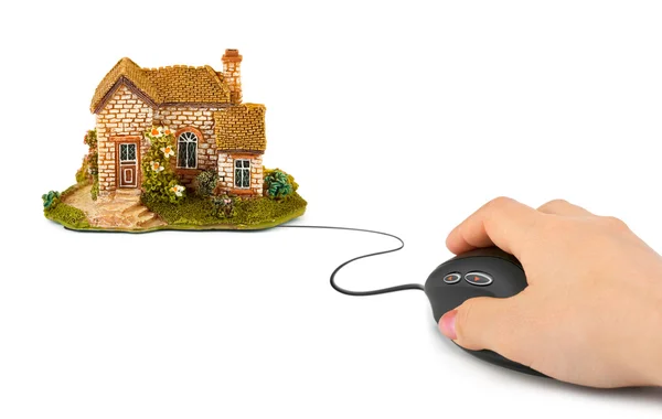 Hand with computer mouse and house — Stock Photo, Image