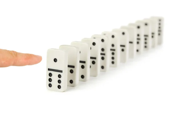 Finger and domino — Stock Photo, Image
