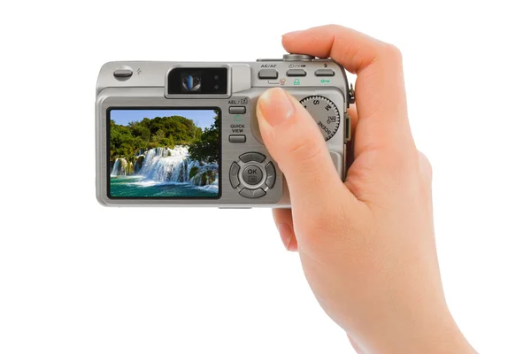 Camera in hand and waterfall (my photo) — Stock Photo, Image
