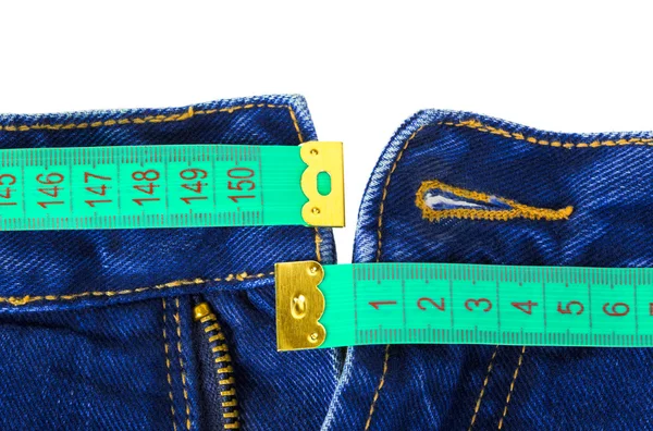 Calça jeans e fita métrica — Fotografia de Stock
