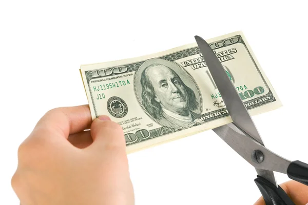 Manos con tijeras cortando dinero — Foto de Stock