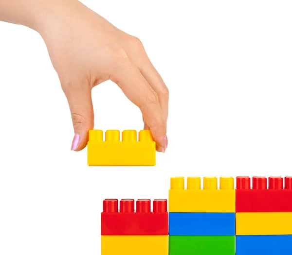 Hand and toy wall — Stock Photo, Image