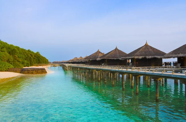Water bungalows on a tropical island at evening — Stock Photo, Image