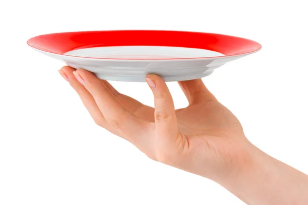 Рука с тарелкой — стоковое фото