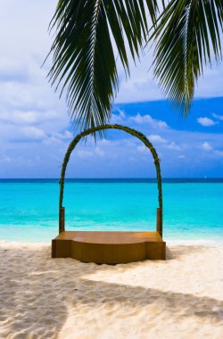 Wedding archway at tropical beach clipart