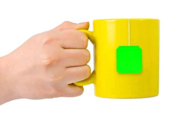 Ręka z filiżanką herbaty — Zdjęcie stockowe