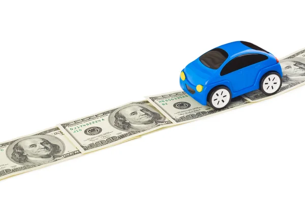 Speelgoedauto op geld weg — Stockfoto
