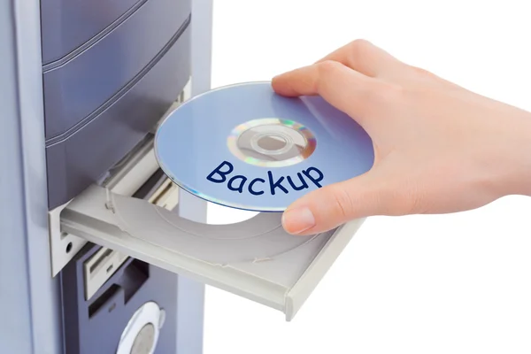 Rukou a počítače na disku zálohování — Stock fotografie