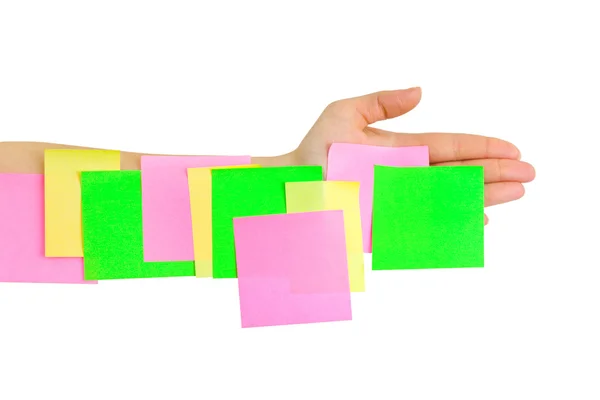 Ruka a vícebarevný papír — Stock fotografie