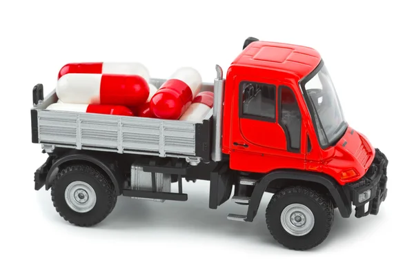 薬と一緒におもちゃのトラック — ストック写真