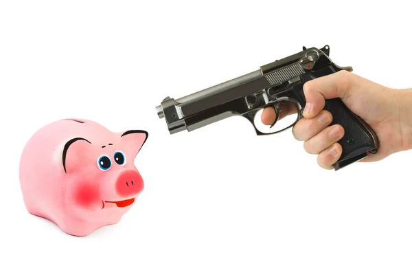 Banco porquinho e mão com arma — Fotografia de Stock