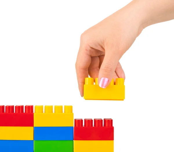 Hand and toy wall — Stock Photo, Image