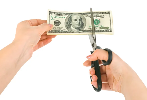 Mãos com tesoura cortando dinheiro — Fotografia de Stock