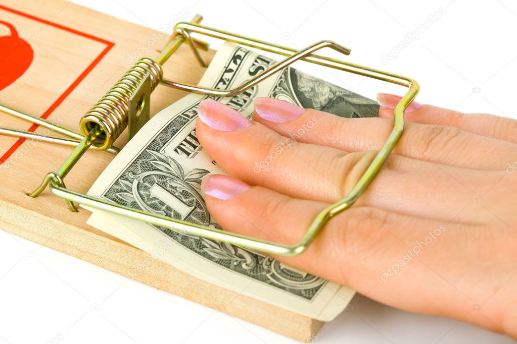 Hand and mousetrap with money