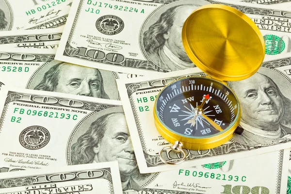 Kompas a peníze — Stock fotografie