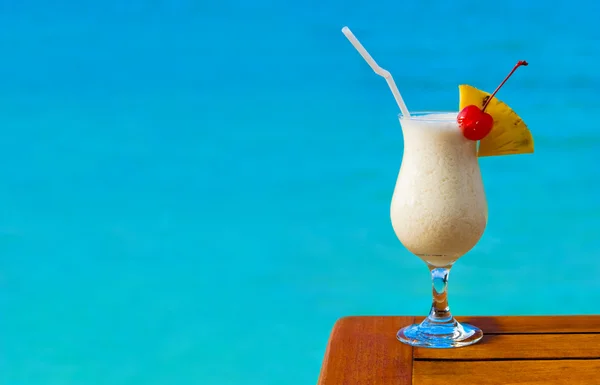 Milk cocktail on table at beach cafe — Stock Photo, Image