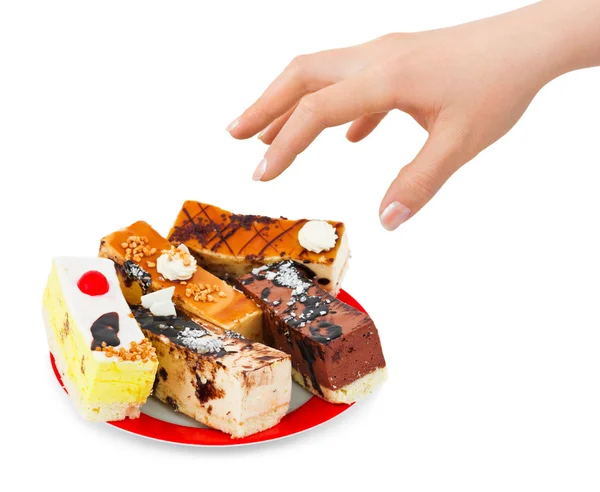 Cakes and hand — Stock Photo, Image