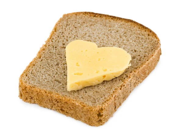 Bröd och hjärtat formad ost — Stockfoto