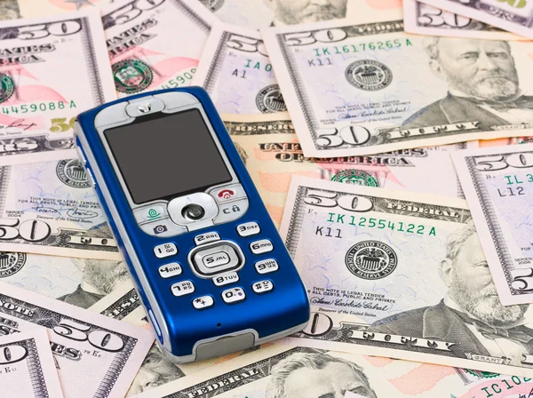 Mobile phone on money background — Stock Photo, Image
