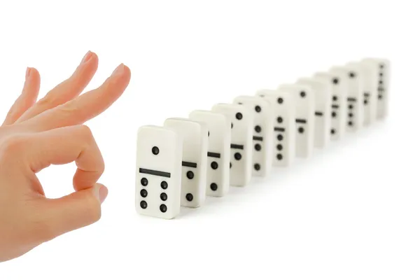Hand und Dominostein — Stockfoto
