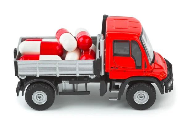 Toy truck with pills — Stock Photo, Image