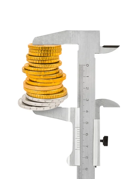 Calipers and stack of coins — Stock Photo, Image