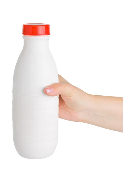 Mão com garrafa de leite — Fotografia de Stock