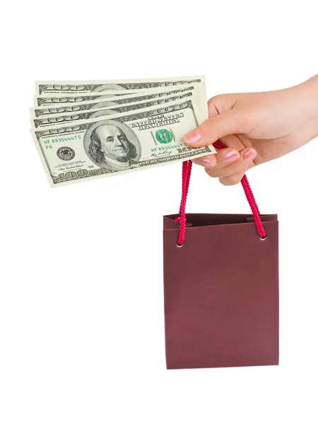 Ręka z pieniędzy torby na zakupy — Zdjęcie stockowe
