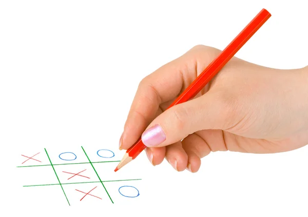 Hand with pencil and game — Stock Photo, Image