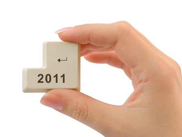 Кнопка комп'ютера 2011 в руці — стокове фото