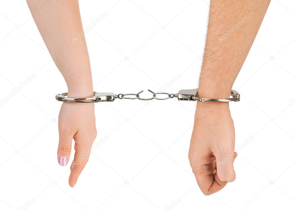 Man and woman hands and breaking handcuffs