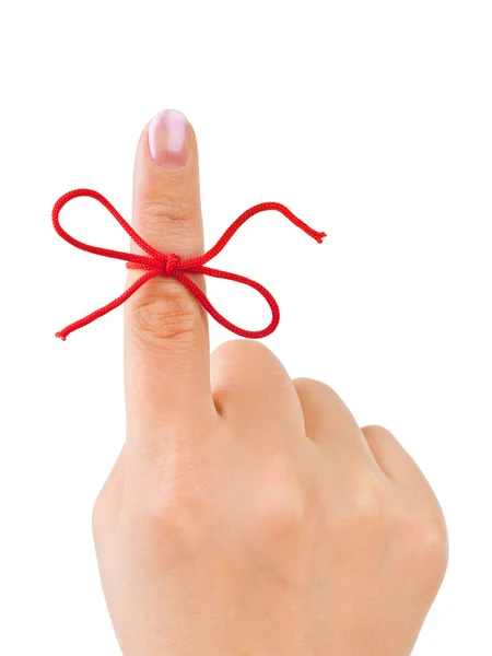 Czerwona kokarda na palec — Zdjęcie stockowe
