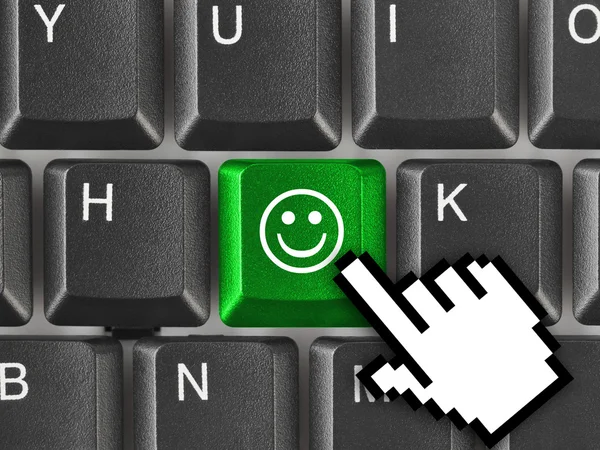 Počítačová klávesnice s úsměvem klíčem — Stock fotografie