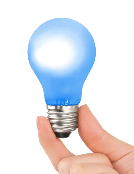 Hand med blå lampa — Stockfoto