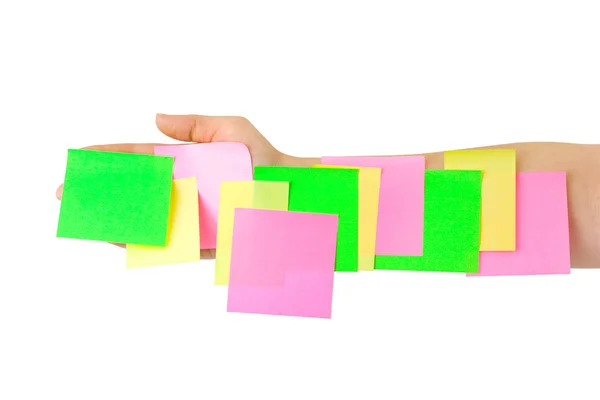 Mão e papel de nota multicolorido — Fotografia de Stock