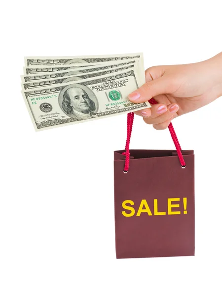 Hand med pengar shoppingväska försäljning — Stockfoto