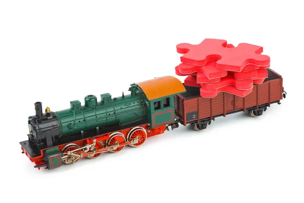 Trem de brinquedo com quebra-cabeça — Fotografia de Stock