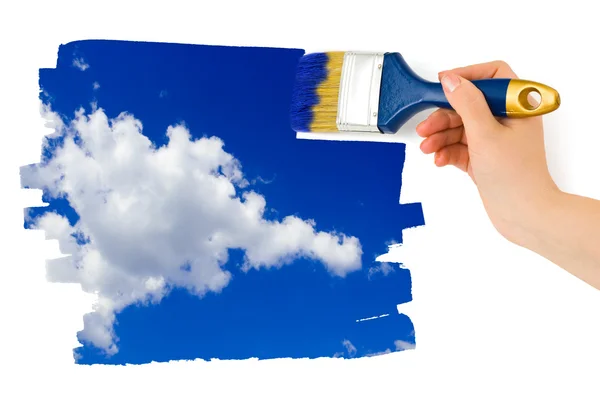 Hand met penseel schilderij sky — Stockfoto
