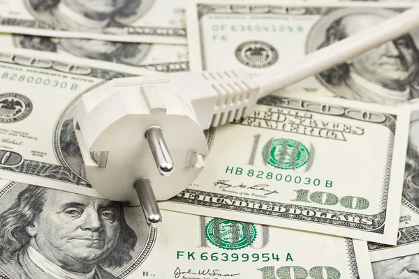 Electric plug on money — Stock Photo, Image