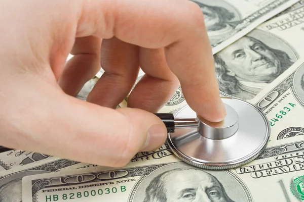 Hand Mit Stethoskop Und Geld Medizinischer Hintergrund — Stockfoto