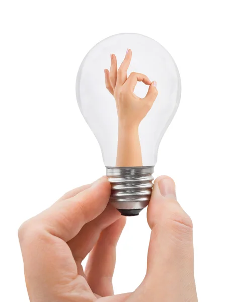 Mão com lâmpada e sinal OK — Fotografia de Stock