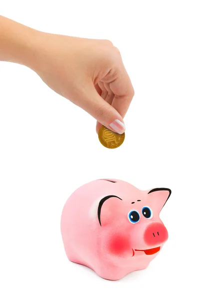 Banco porquinho e mão com moeda — Fotografia de Stock